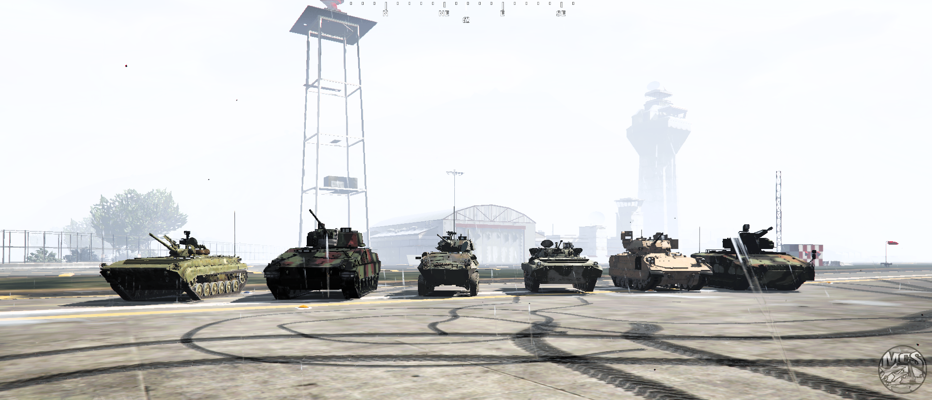 Five military tanks lined up at airport tarmac — ground forces showcase on MCS FiveM server